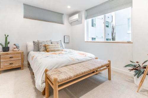 a bedroom with a bed and a window at Ballard's Pet-Friendly Mid Century Home + Rooftop Deck in Seattle