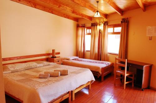 Postel nebo postele na pokoji v ubytování Quechua Hotel