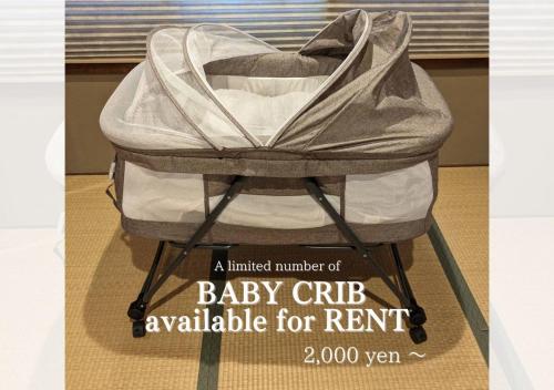 a baby crib available for rent on a display at Apartment HOTEL KIRO Kyoto STATION in Kyoto