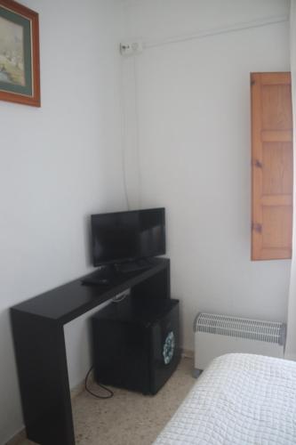 TV a/nebo společenská místnost v ubytování HOSTAL MONCADA