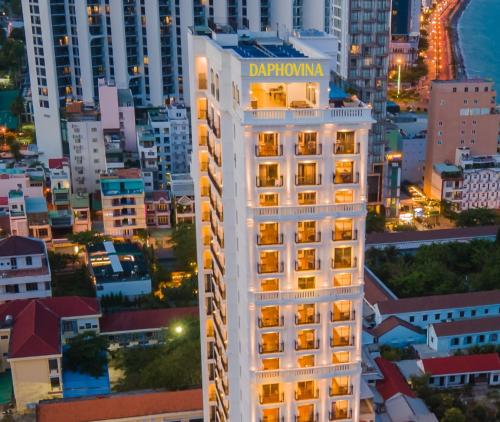 a building in the city at night at Daphovina Hotel in Nha Trang