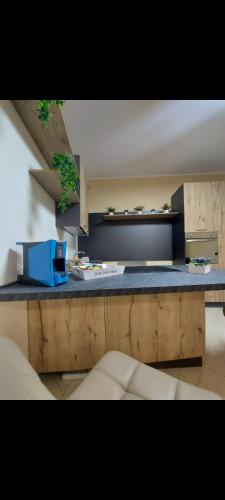 a kitchen with a counter with a blue counter top at KALGHEROS Luxury Rooms in Agrigento