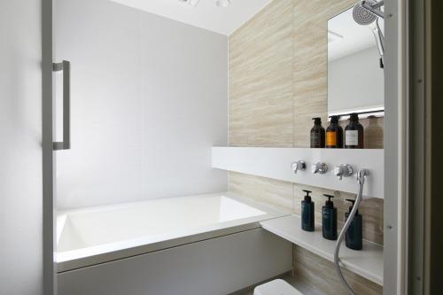 a bathroom with a sink and a shower at Machizukitei - Vacation STAY 82078 in Kyoto