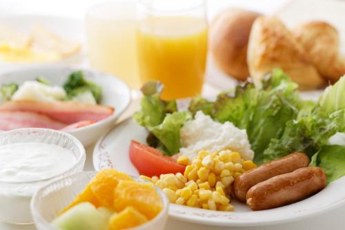a plate of food with a variety of foods on a table at Kumamoto Washington Hotel Plaza in Kumamoto