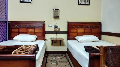 Una cama o camas en una habitación de فندق هاميس