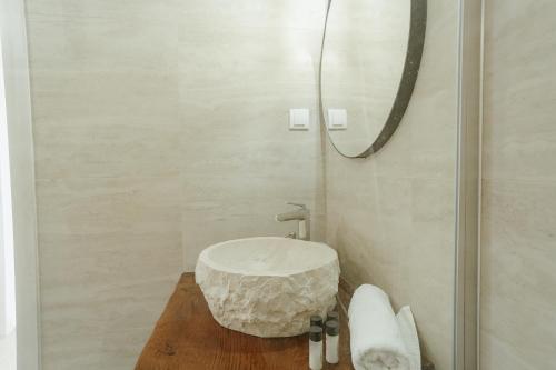 a bathroom with a sink and a mirror at Casa di Pietra in Kotor