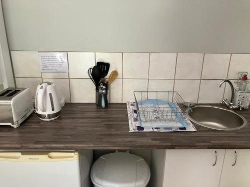 a kitchen counter top with a sink and a counter top at Time & Again in Ceres