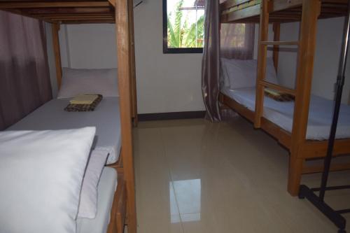 Katil atau katil-katil dalam bilik di Sealor Pension House