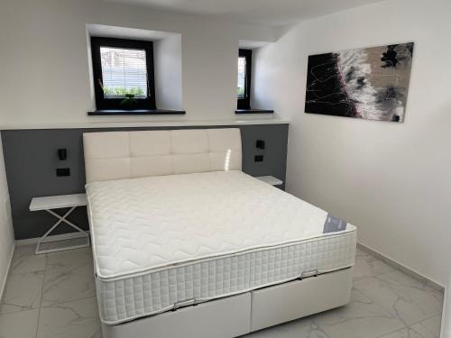 Postel nebo postele na pokoji v ubytování Apartment Aria