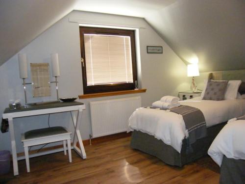 Una cama o camas en una habitación de Kirkside