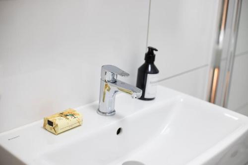 a bathroom sink with a faucet on top of it at Fabrikdesign Düren in Düren - Eifel