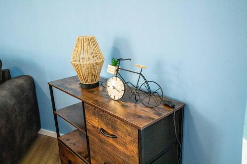 a table with a lamp and a bike on it at Fabrikdesign Düren in Düren - Eifel