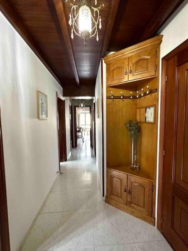 a hallway of a home with a chandelier at A do Caseiro in O Barqueiro