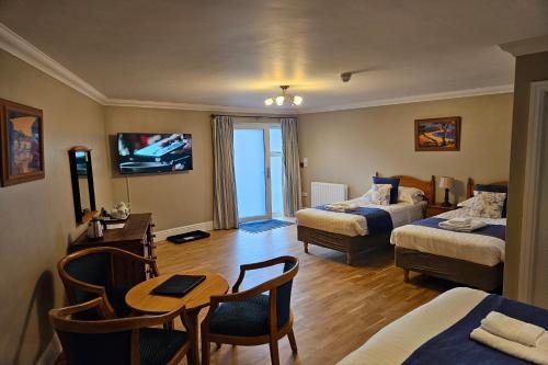 Ένα ή περισσότερα κρεβάτια σε δωμάτιο στο Brathay Lodge