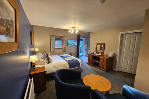 Ένα ή περισσότερα κρεβάτια σε δωμάτιο στο Brathay Lodge