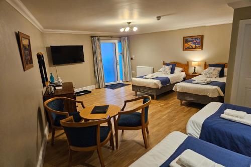 Ένα ή περισσότερα κρεβάτια σε δωμάτιο στο Brathay Lodge