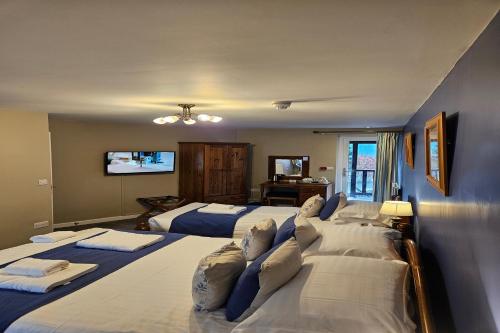 Ένα ή περισσότερα κρεβάτια σε δωμάτιο στο Brathay Lodge