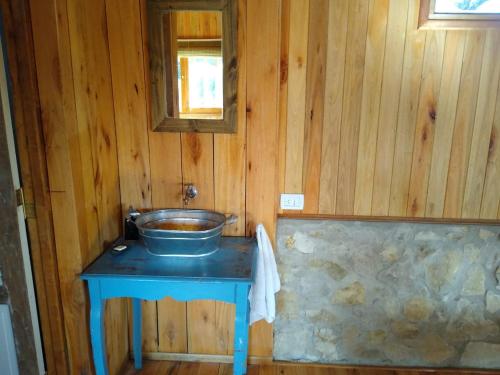 a bathroom with a sink on a blue table at tyny chapa in Chapadmalal