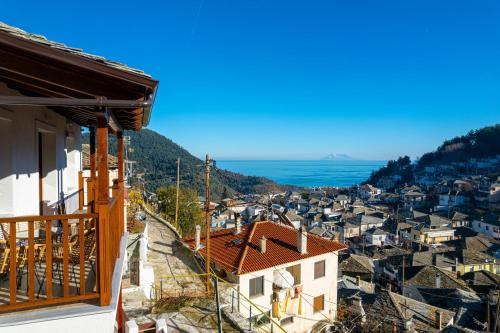 a view of a town with the ocean in the background at Enavlion Luxury Domes in Panayia