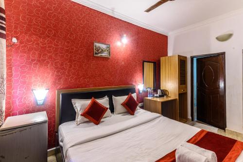 Ένα ή περισσότερα κρεβάτια σε δωμάτιο στο De Alara Calangute