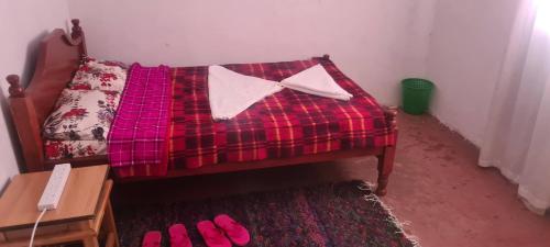Ένα ή περισσότερα κρεβάτια σε δωμάτιο στο Olgosua Homestay Maasai Mara
