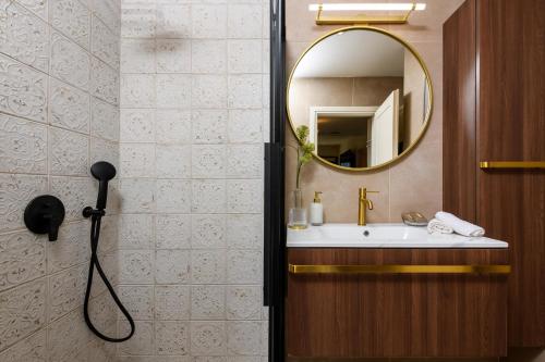 a bathroom with a sink and a mirror at Enavlion Luxury Domes in Panayia