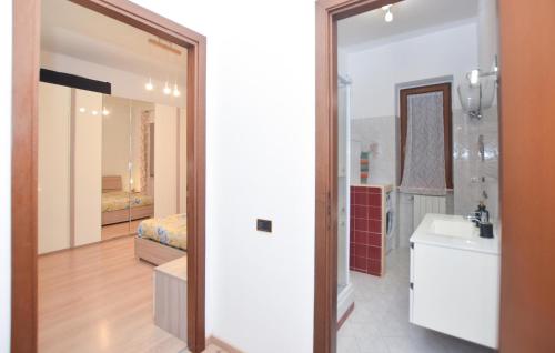 a bathroom with a sink and a mirror at Awesome Apartment In Tuscania With Kitchenette in Tuscania