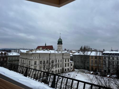 a view of a large building with a clock tower at High Standard Room in Jewish District, Apartment Shared with Host in Kraków