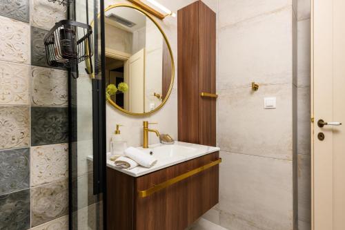 a bathroom with a sink and a mirror at Enavlion Luxury Domes in Panayia
