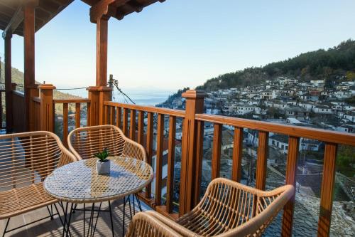 a balcony with chairs and a table with a view at Enavlion Luxury Domes in Panayia