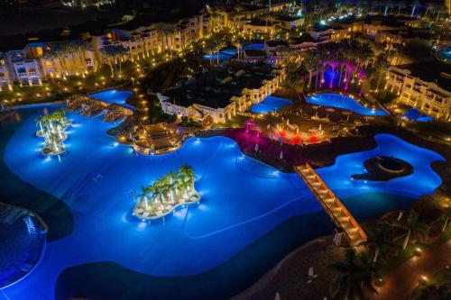 an aerial view of a resort at night at Rixos Sharm El Sheikh - Adults Only 18 Plus in Sharm El Sheikh
