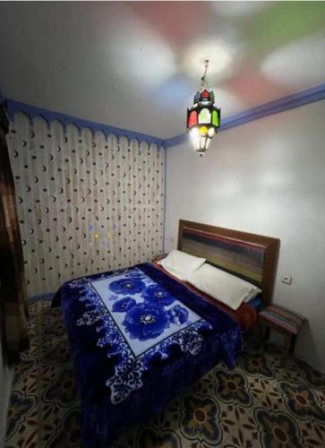 Ein Bett oder Betten in einem Zimmer der Unterkunft Dar nayla