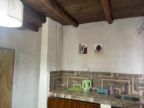 a kitchen with a counter top with a sink at Cab,SE,1,2 in Villa Los Aromos