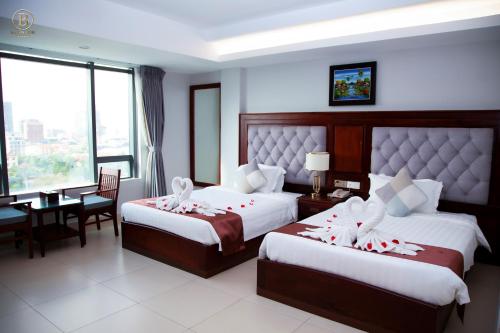 Cama o camas de una habitación en Ban Ban Hotel