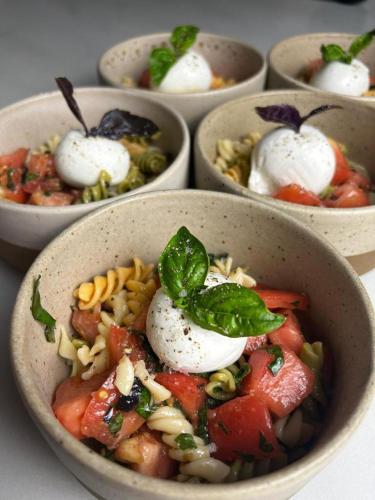 a group of bowls of food on a table at La Montaña Mágica Hotel Rural in Vibaño