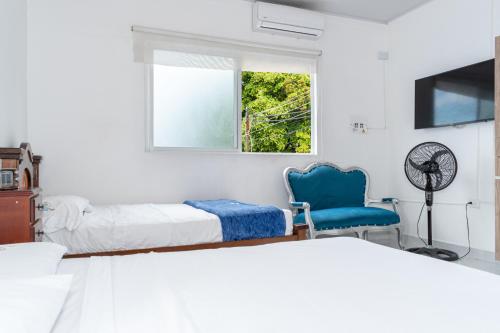 Cama ou camas em um quarto em Casa Hotel Victoria Real