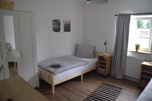 En eller flere senge i et værelse på TKS HOME Zur Tenne