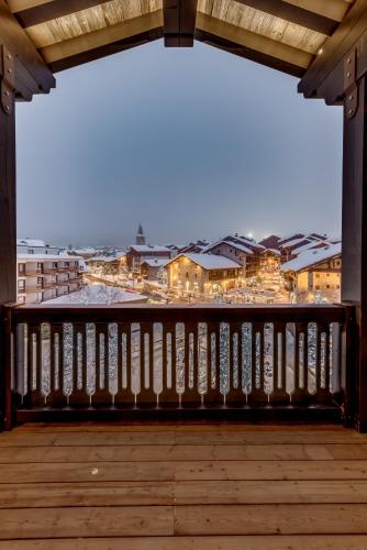 a view from the balcony of a building at Hotel & Spa Le Val d'Isère in Val dʼIsère