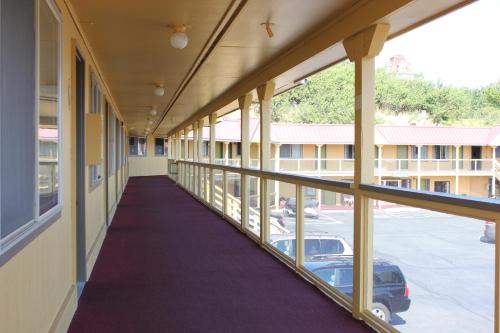 an empty hallway of a building with a balcony at Port Townsend Inn in Port Townsend