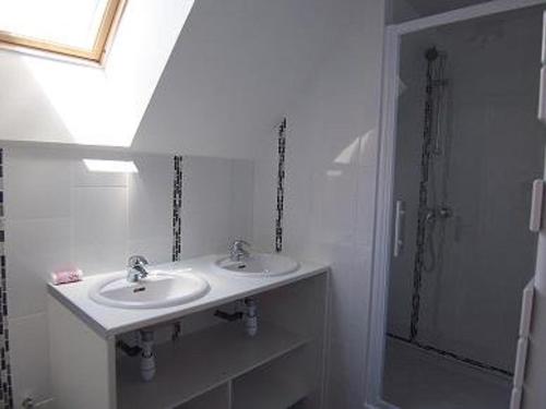 a white bathroom with a sink and a shower at Maison Spacieuse à Carnac - 4 Chambres, Terrasse et Jardin, Proche Plage et Commerces - FR-1-377-45 in Carnac