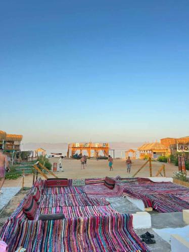 a large pile of rugs on the ground at Green Beach Camp & Hotel in Nuweiba
