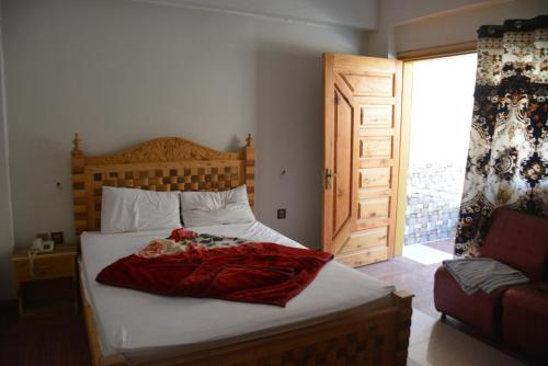 Ένα ή περισσότερα κρεβάτια σε δωμάτιο στο PC Green Hotel, Mahandri, Kaghan
