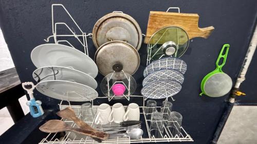 a pile of dishes and utensils on a table at Apartaestudio en los llanos in Monterrey