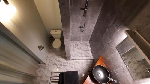 an overhead view of a bathroom with a shower at Chez Nous Chez Vous in Toubakouta