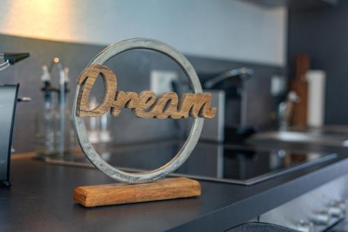 a metal sign that says organ on a counter at SweetHome - Poing Apartments in Poing