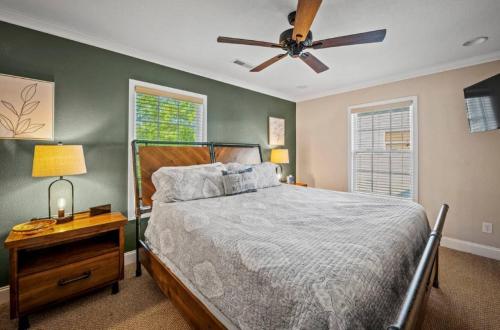 a bedroom with a bed and a ceiling fan at Creekside Cottage*Hot Tub*Entire Home-Pigeon Forge in Pigeon Forge