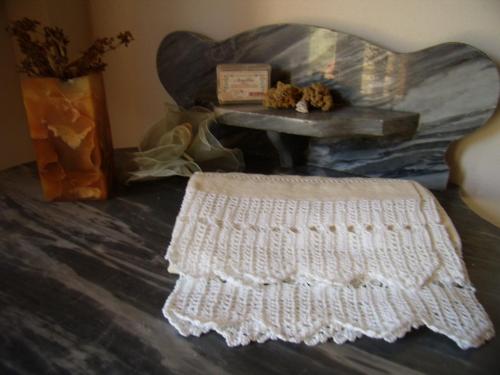 a white crochet rug on a bed with a table at Antico Casale dei Sogni agriturismo in Lugo