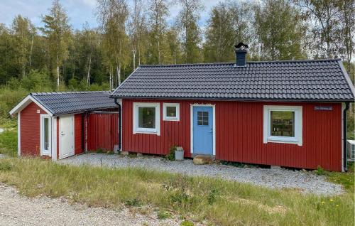 two red buildings are parked next to each other at Stunning Home In Tingsryd With Sauna in Tingsryd