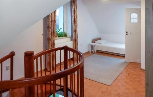 a room with a staircase leading to a bedroom at Awesome Home In Pisz With Wi-fi in Pisz
