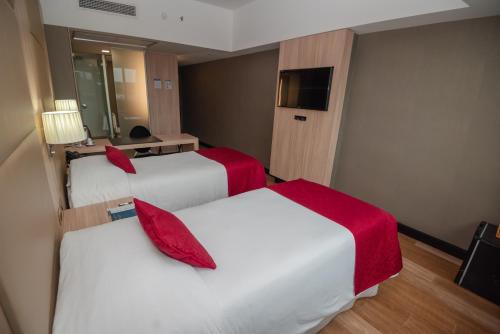 Katil atau katil-katil dalam bilik di Savoy Hotel Encarnación